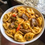 cheesesteak tortellini in rich provolone sauce