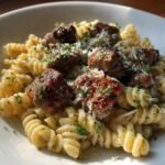 garlic parmesan steak bites with cajun twisted pasta