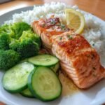 salmon broccoli rice cucumber plate