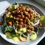 bold and flavorful divorce salad with spicy chickpeas and tangy avocado dressing