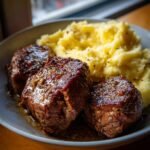 garlic pepper steak medallions with buttery mashed potatoes
